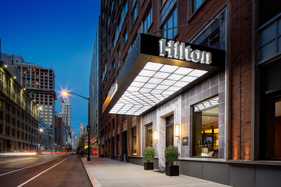 Entrance of the Hilton Brooklyn hotel, managed by hospitality operations and hotel asset management company, hotelAVE